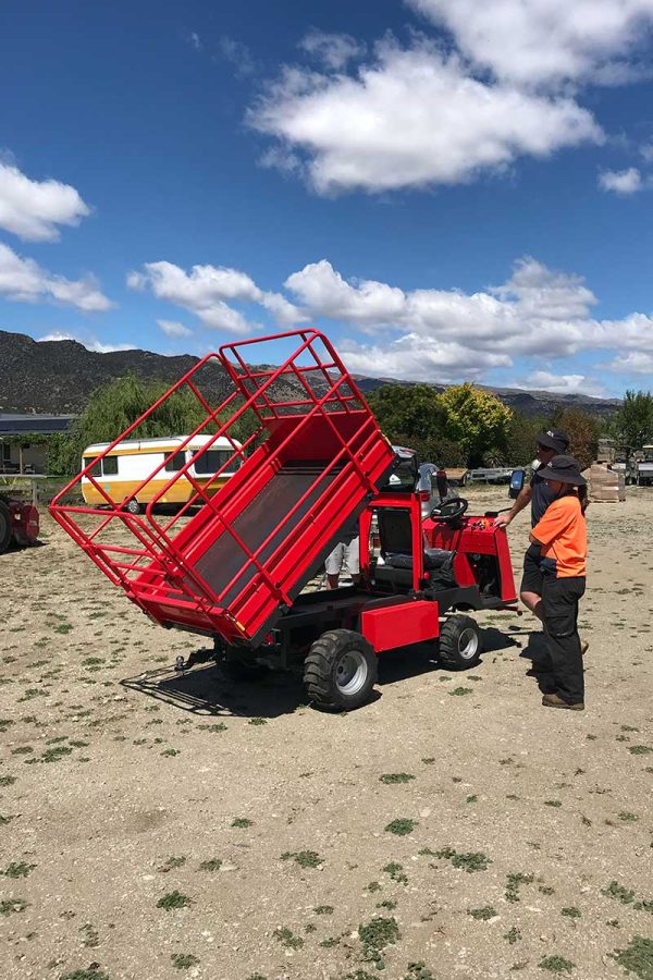 red pickman electric picca work platform in tipper mode with central otago hills in background