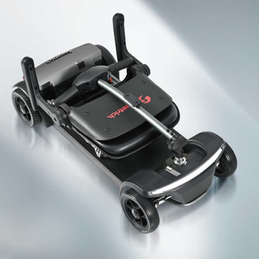 a black sweet rich foldable electric scooter folded up ready for transport  on display at e-motors nz in queenstown